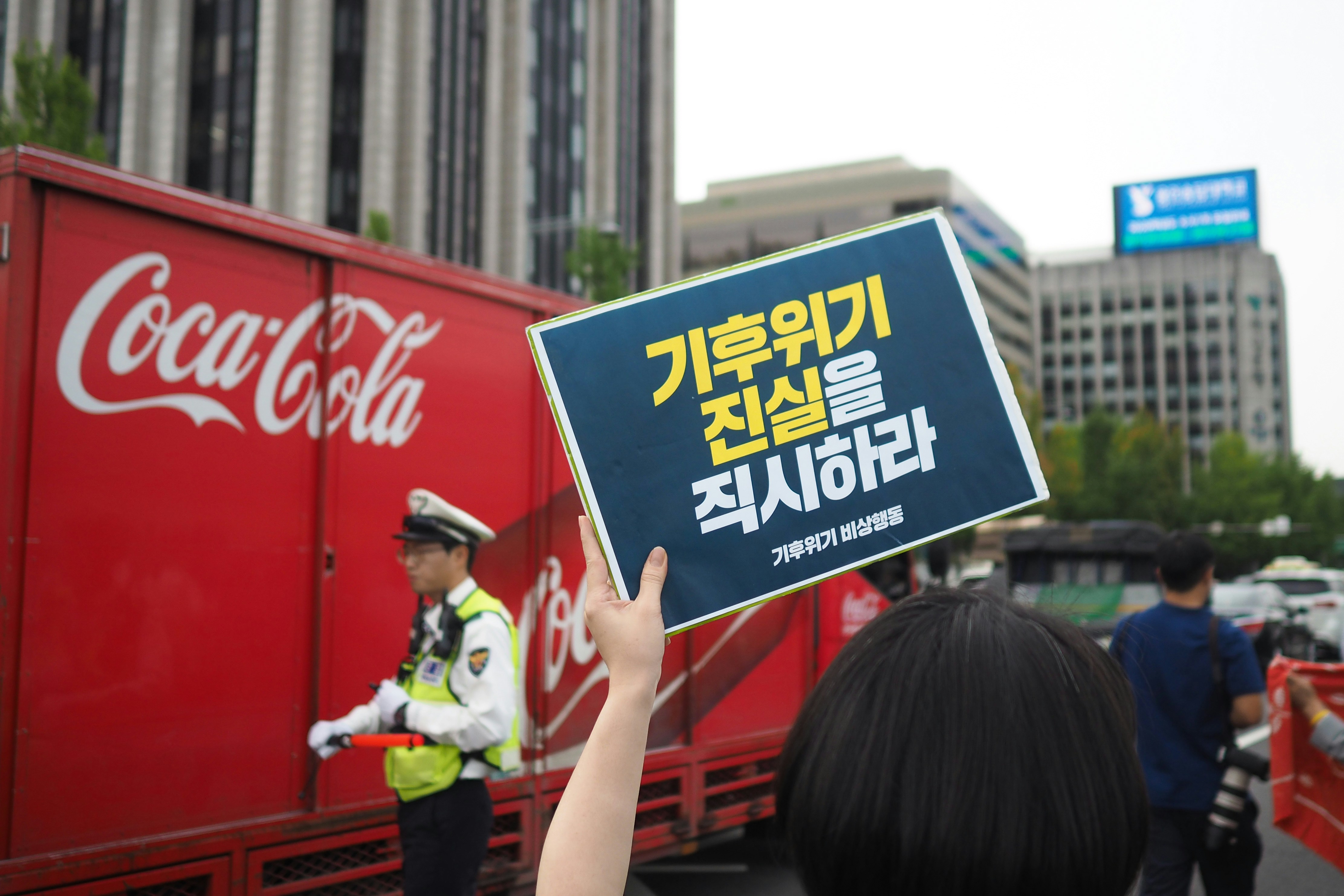 man near Coca-Cola signage
